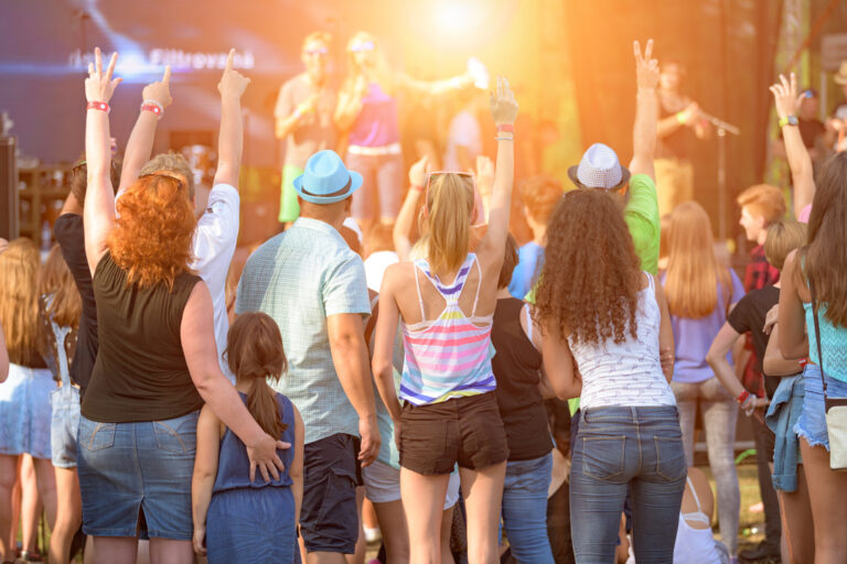 People of different ages enjoying an outdoors music, culture, community event, festival